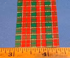 One spool of Lion Ribbon (1 3/8" by 34 yards) -- Holly pattern