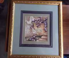 Pair of ornate gold framed pictures
